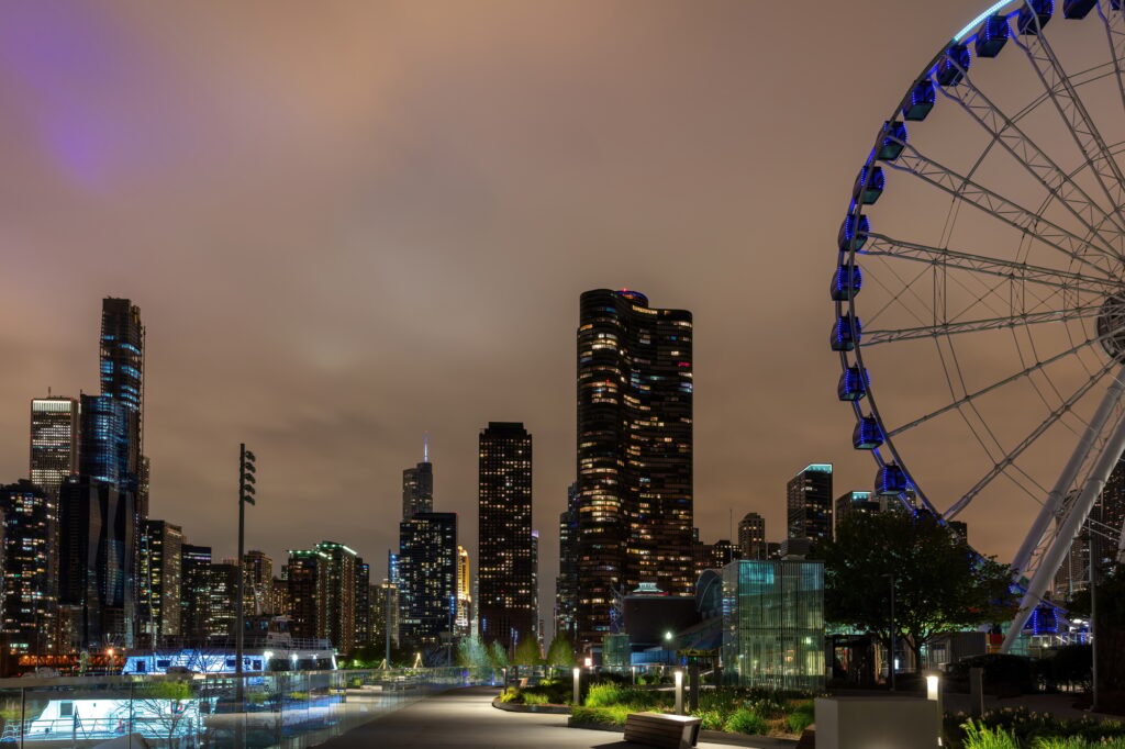 Chicago city high rise buildings illuminated and Centennial Wheel at Navy Pier. Illinois USA