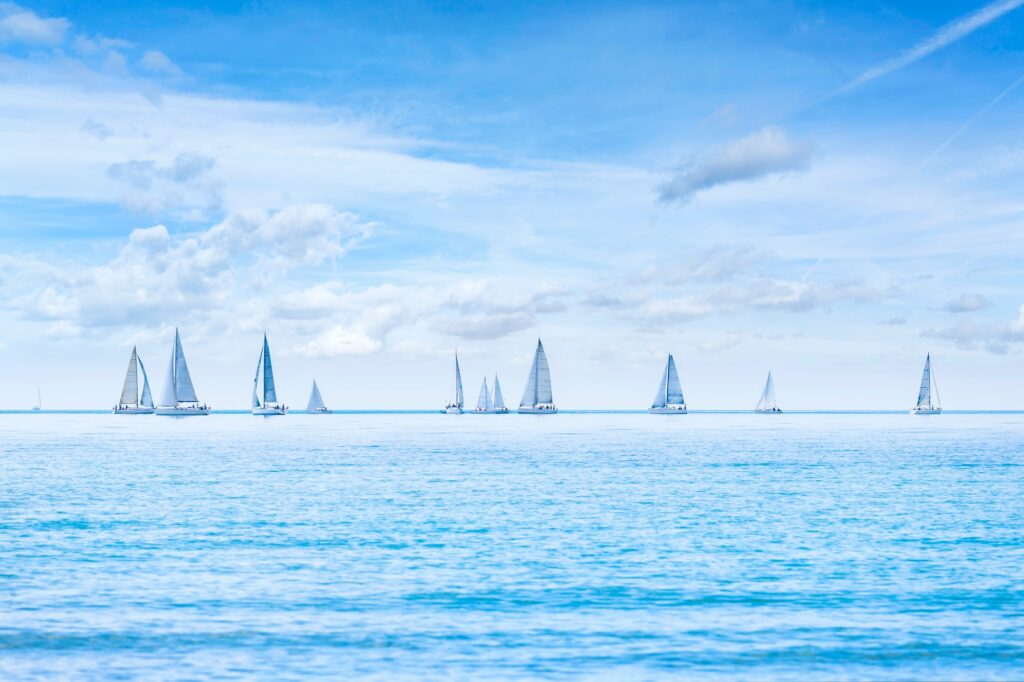 Sailing boat yacht regatta race on sea or ocean water